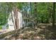 Two-story home with stairs leading up to an entrance, showing the home's architecture and garage at 535 Toonigh Rd, Woodstock, GA 30188