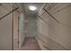 Spacious walk-in closet provides ample storage with multiple shelves, maximizing organization and convenience at 535 Toonigh Rd, Woodstock, GA 30188