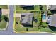 Aerial view of a home with a swimming pool and a well-manicured lawn and a yellow property outline at 7575 Old Camp Lndg, Cumming, GA 30040