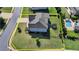 Aerial view of a home with a swimming pool and a well-manicured lawn, highlighting its outdoor amenities at 7575 Old Camp Lndg, Cumming, GA 30040