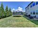 A backyard featuring a patio with furniture, a trampoline and a privacy fence to complete the outdoor experience at 7575 Old Camp Lndg, Cumming, GA 30040
