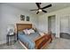 Comfortable bedroom featuring a ceiling fan, natural light, and neutral tones for a restful retreat at 7575 Old Camp Lndg, Cumming, GA 30040