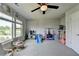 Spacious bedroom features natural light, ceiling fan, and ample space for play, creating an inviting atmosphere at 7575 Old Camp Lndg, Cumming, GA 30040