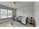 Neutral toned bedroom with a twin bed and a window with view at 7575 Old Camp Lndg, Cumming, GA 30040