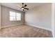 Bright bedroom features neutral walls, plush carpet, ample lighting, and a large window at 7575 Old Camp Lndg, Cumming, GA 30040