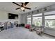 Bright bedroom with large windows, ceiling fan, and neutral tones offers a cozy and inviting space at 7575 Old Camp Lndg, Cumming, GA 30040