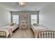 This bedroom is light and bright with carpet and a neutral paint color scheme at 7575 Old Camp Lndg, Cumming, GA 30040