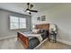 Cozy bedroom featuring a ceiling fan, natural light, and neutral tones for a restful retreat at 7575 Old Camp Lndg, Cumming, GA 30040