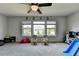 Spacious bonus room with backyard view and ample space for activities at 7575 Old Camp Lndg, Cumming, GA 30040