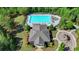 Aerial view of community pool with lounge chairs, landscaping, and playground nearby at 7575 Old Camp Lndg, Cumming, GA 30040