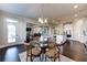 Bright dining area connected to the kitchen and living room, featuring a stylish table set and natural light at 7575 Old Camp Lndg, Cumming, GA 30040