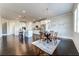 Open-concept kitchen and dining area with ample counter space, stainless steel appliances, and plenty of seating at 7575 Old Camp Lndg, Cumming, GA 30040