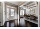 Elegant dining room featuring coffered ceilings, hardwood floors, and a stylish chandelier at 7575 Old Camp Lndg, Cumming, GA 30040