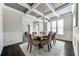 Stylish dining room showcasing wainscoting and hardwood floors, perfect for entertaining at 7575 Old Camp Lndg, Cumming, GA 30040