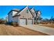 Well-maintained brick home with a spacious driveway and lush landscaping in a Gathering-friendly neighborhood at 7575 Old Camp Lndg, Cumming, GA 30040