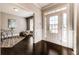 Inviting foyer with hardwood floors, complemented by wainscoting and ample natural light at 7575 Old Camp Lndg, Cumming, GA 30040