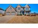 Charming two-story brick home with a manicured lawn and a two-car garage in a sought-after community at 7575 Old Camp Lndg, Cumming, GA 30040