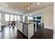 Spacious kitchen with stainless steel appliances, a central island, and dining area near bright windows at 7575 Old Camp Lndg, Cumming, GA 30040