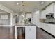 Modern kitchen with a large island, stainless steel appliances, and sleek countertops offers ample space and convenience at 7575 Old Camp Lndg, Cumming, GA 30040