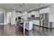 Well-equipped kitchen with a spacious island, stainless steel appliances, and modern design at 7575 Old Camp Lndg, Cumming, GA 30040