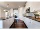 Contemporary kitchen with stainless steel appliances, granite countertops, and modern lighting at 7575 Old Camp Lndg, Cumming, GA 30040