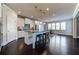 Bright, open kitchen with stainless steel appliances, granite countertops, and adjacent dining area at 7575 Old Camp Lndg, Cumming, GA 30040
