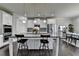 Elegant kitchen featuring a center island, sleek countertops, and stylish lighting fixtures at 7575 Old Camp Lndg, Cumming, GA 30040