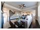 Bright and airy living room featuring hardwood floors, fireplace, and an open floor plan leading to the kitchen at 7575 Old Camp Lndg, Cumming, GA 30040