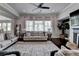 Stylish living room featuring a fireplace and neutral color palette at 7575 Old Camp Lndg, Cumming, GA 30040