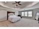 Spacious main bedroom with decorative tray ceiling and large windows at 7575 Old Camp Lndg, Cumming, GA 30040