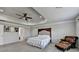 Spacious main bedroom with decorative tray ceiling and large windows at 7575 Old Camp Lndg, Cumming, GA 30040