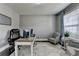 Bright home office with neutral walls, a large window, and a comfortable seating area at 7575 Old Camp Lndg, Cumming, GA 30040