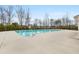 A large community swimming pool with a spacious deck area for relaxing at 7575 Old Camp Lndg, Cumming, GA 30040