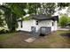 Backyard featuring a small deck with gray wood steps and a view of the house's exterior at 1120 Arlington Sw Ave, Atlanta, GA 30310