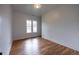 Bedroom with hardwood floors, a window providing natural light, and neutral paint at 1120 Arlington Sw Ave, Atlanta, GA 30310