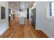 Open-concept kitchen with an island, stainless steel appliances, and hardwood floors throughout the house at 1120 Arlington Sw Ave, Atlanta, GA 30310