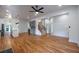Spacious living room featuring hardwood floors, an open floorplan, and a stylish ceiling fan at 1120 Arlington Sw Ave, Atlanta, GA 30310