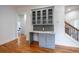 A stylish office nook features marble countertop, gray cabinets, and tile backsplash near hardwood floors at 1120 Arlington Sw Ave, Atlanta, GA 30310