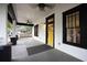 Inviting front porch featuring black trim, a bright yellow door, and classic architectural details at 1120 Arlington Sw Ave, Atlanta, GA 30310