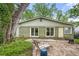 Backyard with patio and mature trees providing shade at 2364 Woodside Way, Atlanta, GA 30341