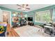Spacious bedroom with hardwood floors, natural light, and entertainment/office area at 2364 Woodside Way, Atlanta, GA 30341