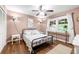 Cozy bedroom with hardwood floors, and window offering natural light at 2364 Woodside Way, Atlanta, GA 30341