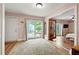 Bright bedroom with wood floors, backyard access, and adjoining living area at 2364 Woodside Way, Atlanta, GA 30341
