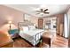 Bright bedroom with wood flooring, ceiling fan, and adjoining living area at 2364 Woodside Way, Atlanta, GA 30341