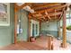 Wood porch featuring brick and wood walls, a ceiling fan, and potted plants at 2364 Woodside Way, Atlanta, GA 30341