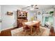 Charming dining room featuring wooden furniture, ceiling fan and access to living area at 2364 Woodside Way, Atlanta, GA 30341