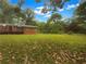 Spacious backyard with well-maintained lawn and mature trees, perfect for outdoor activities at 4261 E Conley Rd, Conley, GA 30288