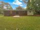 The backyard features a lawn and a patio outside the sliding glass door at 4261 E Conley Rd, Conley, GA 30288