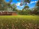 Spacious backyard with well-maintained lawn and mature trees, perfect for outdoor activities at 4261 E Conley Rd, Conley, GA 30288