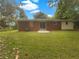 The backyard features a lawn and a patio outside the sliding glass door at 4261 E Conley Rd, Conley, GA 30288